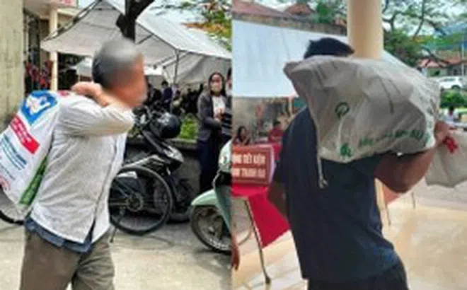 Người dân vác bao tải đi đựng tiền đền bù đất siêu dự án Olympic